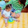 imageBright Starts Press ampamp Glow Spinner Cause and Effect Musical Baby Toy Age 6 MonthsPress  Grow