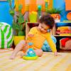 imageBright Starts Press ampamp Glow Spinner Cause and Effect Musical Baby Toy Age 6 MonthsPress  Grow