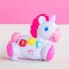 imageBright Starts Rock ampamp Glow Unicorn Crawling Baby Toy with Lights and Melodies Age 6 Months  Pink