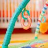 imageBright Starts Wild Wiggles Baby Activity Gym ampamp Play Mat with FoldingToy bar Newborn and up  Green 185 x 291 x 291Green Wild Wiggles